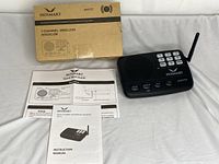 Photo shows the Hosmart 7-channel wireless intercom unit with visible numeric keypad, speaker, volume buttons, and antenna, placed next to original packaging and documents on a white surface.