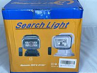 Box showing product illustration and model information, labeled 'Search Light Remote 360° & E120'.
