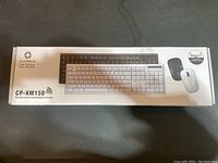 Box of COOLERPLUS CP-KM150 wireless mouse and keyboard combo showing front design with product image and branding.