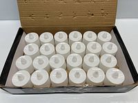 Box with 24 white base LED tea lights arranged inside.
