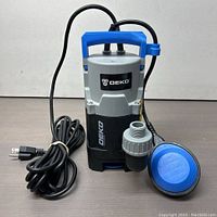Front view of DEKO sump pump showing power cord, handle, and float switch