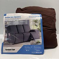 Photo showing the Taococo branded packaging with image of a 3-seater recliner sofa covered by a dark slipcover, along with the folded brown slipcover wrapped in plastic.