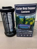 Photo of the Solar Bug Zapper Lantern and its packaging box, showing the product and branding details.