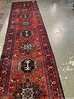 Full view of runner laid on concrete floor showing overall pattern and condition