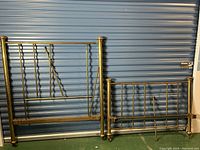 View of the antique brass bed frame showing the headboard and footboard together, missing screws but all rods present.