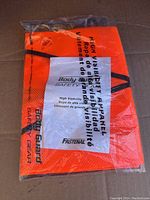 New Body Guard high visibility safety vest in original packaging, bright orange color