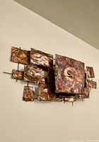 Frontal view of full clock showing all copper panels and central face