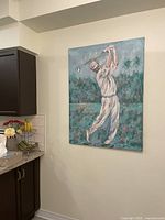Large original textured acrylic painting of a golfer on two joined panels hung on a wall.