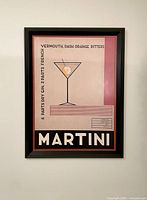 Frontal photo of the framed Martini art print showing the minimalistic cocktail glass illustration and cocktail recipe text.