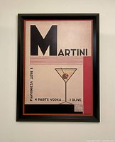 Framed modern art print showing the full artwork with martini glass and text.