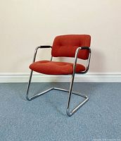 Front-left perspective of chair showing overall design and condition