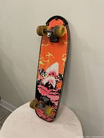 Full view of the vintage Nash skateboard showing deck graphic and wheel setup