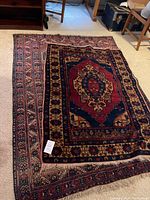 Both rugs overlapped on carpeted floor, showing size difference and overall design.