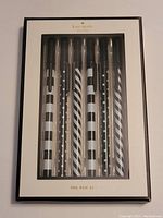 Front of Kate Spade pen set box showing 6 black and white pens with different patterns.