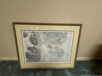 Full view of the framed Robert Bateman print showing snow leopard on snowy rocks.