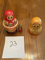 Five Russian nesting dolls displayed individually and nested to show size progression and design details.