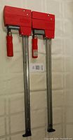 Photo of pair of two Bessey K3.540 clamps showing full length and red handles and clamp heads.