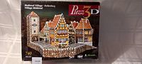 Box front showing the Rothenburg Medieval Village 3D puzzle with the completed model image and number of pieces.