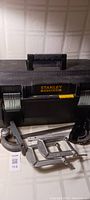 Top view of closed black Stanley Fatmax toolbox showing handle and latch details.
