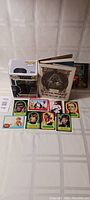 Star Wars lot with vintage sticker book open showing vintage character stickers and Star Wars book with a Funko POP figure box placed beside it.