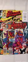 Front view of multiple West Coast Avengers comic books overlapping, showing colorful covers and Marvel logo.