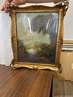 Front view of the original oil painting by Cesy under glass in an ornate gold frame, showing the full artwork and frame details.