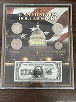 Front view of the framed United States $1 coin collection and Silver Certificate.