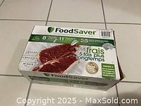 Photo of FoodSaver box showing label with quantity and dimensions of vacuum seal bags.