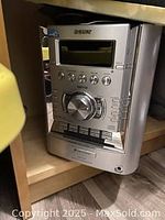 Front view of Sony main sound system unit showing control panel and display screen