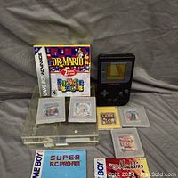 All lot contents displayed on gray cloth backdrop