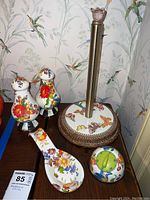 Full set showing paper towel holder with ceramic floral base, salt and pepper shakers, spoon rest, and kitchen timer with colorful floral patterns.