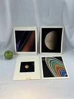Four NASA planetary photos shown with apple for size comparison