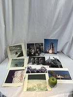 Photos of approximately 11 NASA photographs showing rocket launches, astronauts, lunar modules in space, and Earth views.