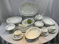 Full display of Paragon 'Corn Field' dinnerware and Finlandia teapot arranged on table