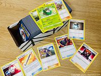 Box containing approximately 350 Pokémon cards along with a sample of cards displayed including Skiddo and Trainer cards.