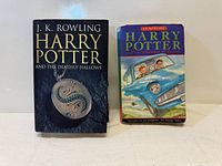 Front covers of two Harry Potter books: 'Harry Potter and the Deathly Hallows' and 'Harry Potter and the Chamber of Secrets'.