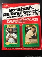 Front of sealed packaging showing the title, two sample cards of Henry Aaron and Mickey Mantle, and text describing the set containing 50 cards.