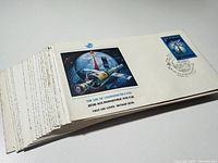 Set of 21 First Day covers stacked showing front artworks and a space exploration themed cover visible on top with a 1981 postmark