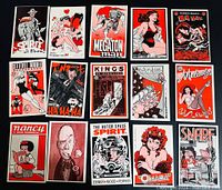 Photo showing 16 of the 26 trading cards laid out in rows, featuring various comic art and titles.