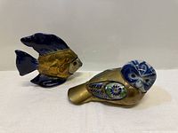 Image showing two vibrantly colored vintage Mexican folk art figurines: a blue and gold tropical fish and a brass and pottery owl.