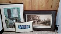 Three framed prints grouped together showing different styles and sizes
