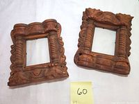 Both carved wood frames displayed together showing their matching design and shape