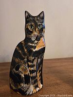 Front view showing detailed cat painting and facial features on vase.