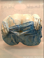 Front view of paper-mache sculpture showcasing overall shape and color