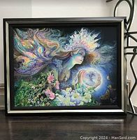 Framed artwork showing the full composition of 'Princess of Light' with the female figure in profile holding an orb surrounded by flowers and butterflies.