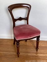 Side view showing profile of balloon-back frame and velvet seat cushion