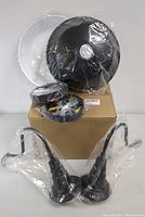 Two MIINO brand black wall sconces packaged in plastic with round backplates and mounting hardware shown on a box.