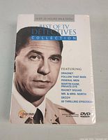 Front cover of the DVD set showing the title and one of the detectives in monochrome.