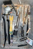 Overview of assorted hand tools showing pry bars, chisels, scraper, grinding head, screwdriver, tweezers, and small tools.