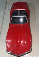 Top-down view showing red body, hood and windshield of the 1970 Corvette die cast car model.